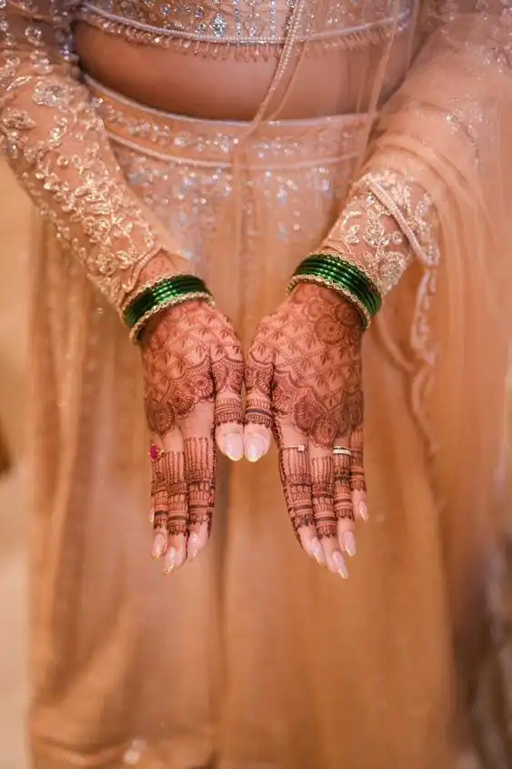 Bridal nude chrome nail extension design with mehndi art in Thrissur